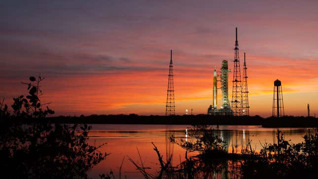 A photo of the Nasa Artemis 1 rocket on the launch pad at sunset. 