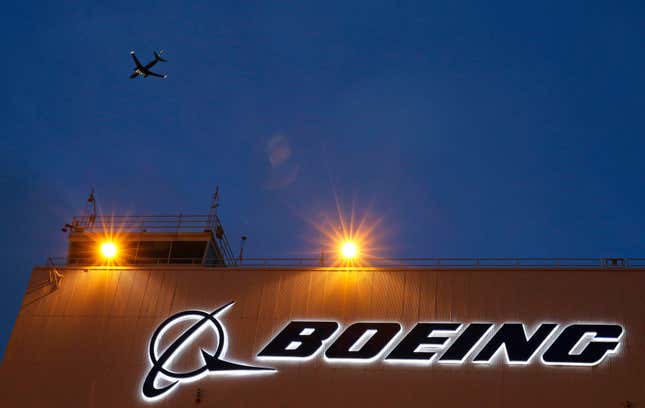 FILE - An airplane flies over a sign on Boeing&#39;s 737 delivery center, Oct. 19, 2015, at Boeing Field in Seattle. The Federal Aviation Administration says a Southwest Airlines jet leaving Denver was forced to land after the engine cover fell off and struck the wing flap during takeoff. Southwest Airlines says the Boeing 737 landed safely Sunday, April 7, 2024, and the passengers headed to Houston are being put onto another aircraft. (AP Photo/Ted S. Warren, File)