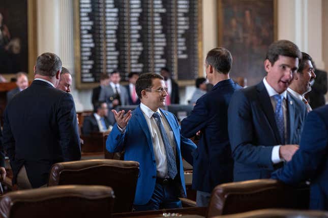  Texas state Rep. Briscoe Cain, R-Deer Park, talks with fellow state representatives in the House chamber on the first day of the 87th Legislature's special session at the State Capitol on July 8, 2021 in Austin, Texas.