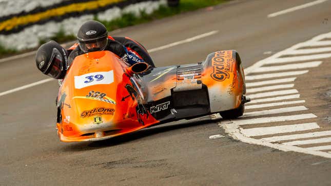 A photo of the orange number 21 bike ridden by César Chanal and Olivier Lavorel. 