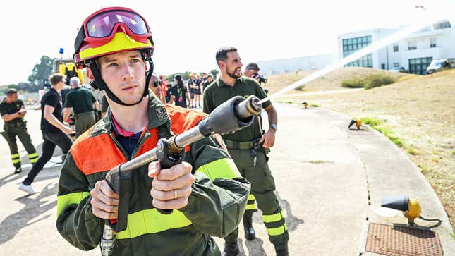 A photo of Andretti driver Timmy Hansen in fireman gear. 