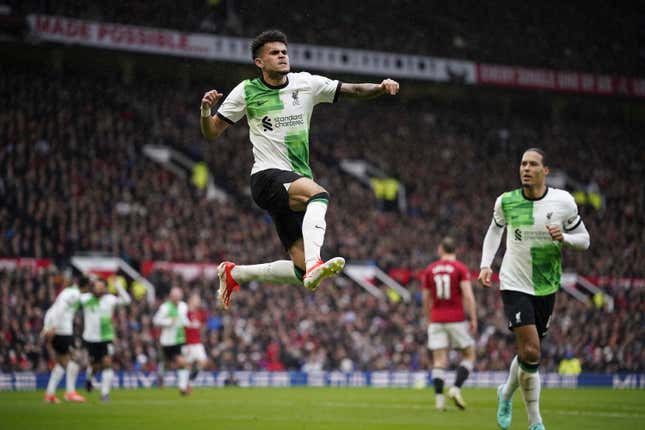 Liverpool&#39;s Luis Diaz, centre, celebrates after scoring the opening goal during the English Premier League soccer match between Manchester United and Liverpool at the Old Trafford stadium in Manchester, England, Sunday, April 7, 2024. (AP Photo/Dave Thompson)