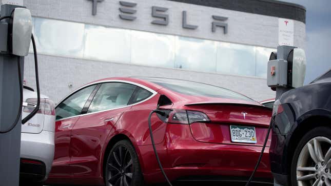 A 2021 Tesla Model 3 sedan sits in a near-empty lot at a Tesla dealership in Littleton, Colo. June 27, 2021. 