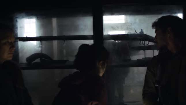 An infected person can be seen through a museum display case holding a rifle.