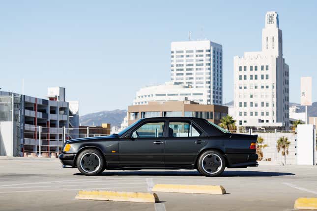 Side view of a black Mercedes-Benz AMG 300E 6.0 Hammer