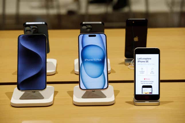 six iphones, three front-facing, on display in an apple store