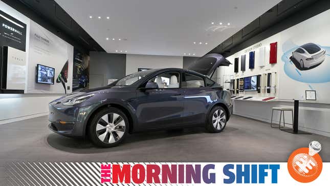 A gray Tesla Model Y seen in a showroom.