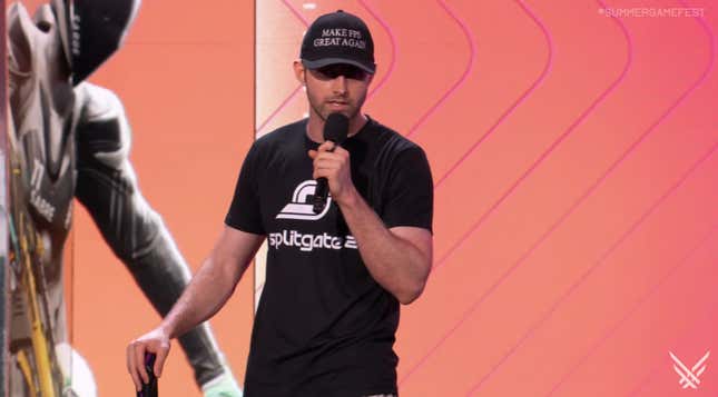 A man wears a hat on stage at SGF.
