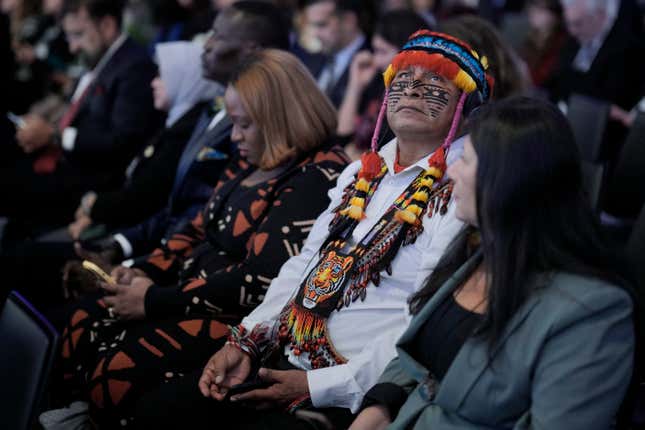 Uyunkar Domingo Peas Nampichkai, a chief of a tribe from Ecuador, listens to a panel discussion on the climate changes at the Annual Meeting of World Economic Forum in Davos, Switzerland, Wednesday, Jan. 17, 2024. The annual meeting of the World Economic Forum is taking place in Davos from Jan. 15 until Jan. 19, 2024.(AP Photo/Markus Schreiber)