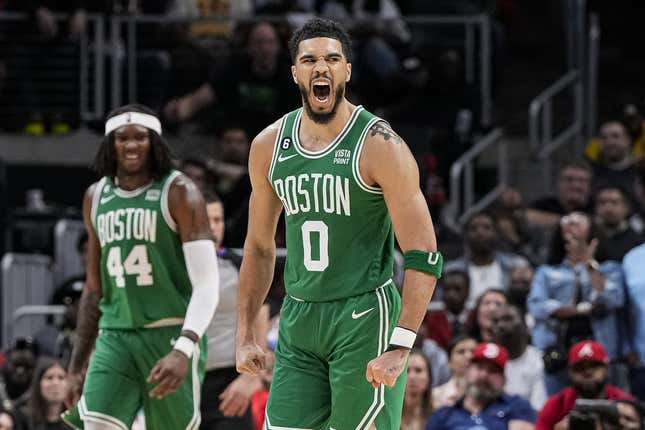 Apr 23, 2023; Atlanta, Georgia, USA; Boston Celtics forward Jayson Tatum (0) reacts after making a long three point shot against the Atlanta Hawks during the second half during game four of the 2023 NBA playoffs at State Farm Arena.