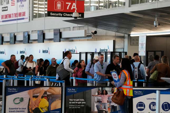 FILE - Travelers wait to go through security check point at O&#39;Hare International Airport in Chicago, Aug. 31, 2023. The Biden administration is giving airports $970 million for improvements in terminals including things like wider concourses, new baggage-handling systems, and more gates. (AP Photo/Nam Y. Huh, File)