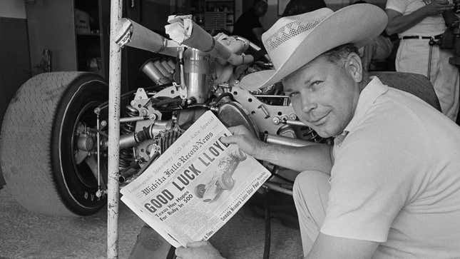 A black and white photo of racing driver Lloyd Ruby. 