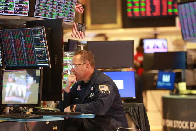 A trader works on the floor of the New York Stock Exchange on Dec. 12.