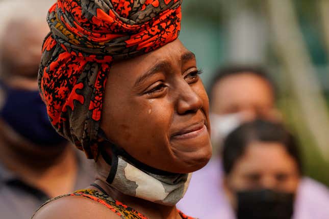 A tear streams down the cheek of Nakia Porter during a news conference to announce the filing of a federal lawsuit she has brought against two Solano County Sheriff’s deputies, in Sacramento, Calif., Wednesday, Aug. 18, 2021.