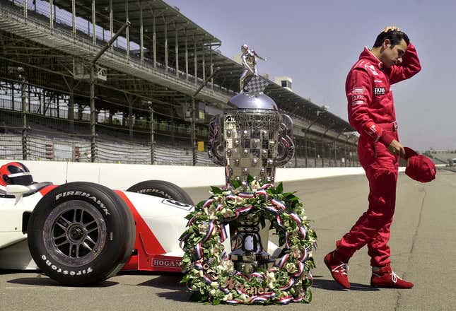 Helio Castronevevs of Brazil, winner of the 85th Indianapolis 500, walks away from his car following a meeting with the media on 28 May 2001 at the Indianapolis Motor Speedway