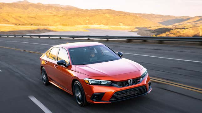 A photo of an orange Honda Civic SI.