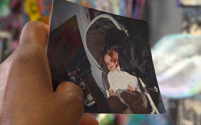 Nadine Young holds a childhood photograph of her granddaughter, Ta’Kiya Young, pictured right, with a younger cousin, at the law offices of the family attorney in Columbus, Ohio, on Wednesday, Sept. 6, 2023. 