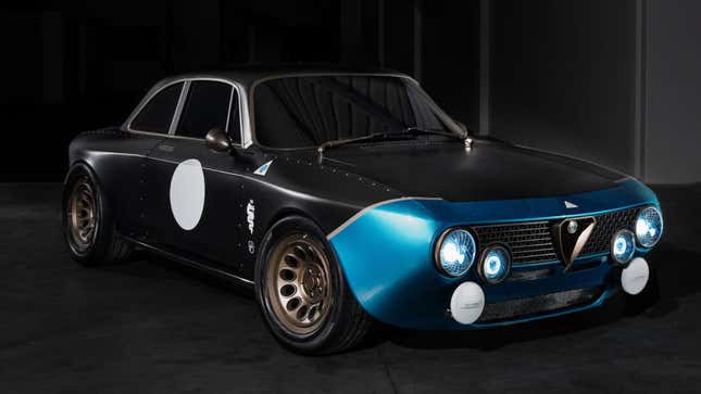 A photo of an Alfa Romeo restomod with bare carbon fiber. 