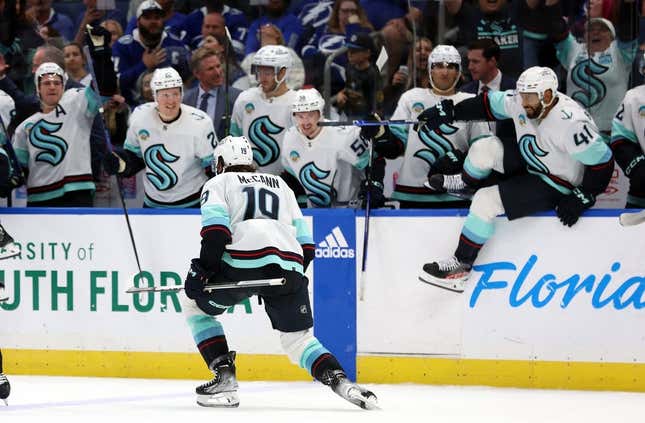 Oct 30, 2023; Tampa, Florida, USA; Seattle Kraken left wing Jared McCann (19) celebrates with teammates after they beat the Tampa Bay Lightning during overtime at Amalie Arena.