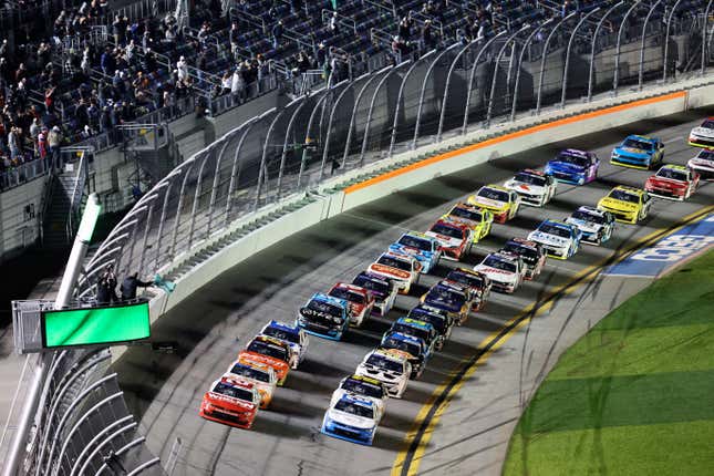 Jesse Love, front left, and Austin Hill, front right, lead the field to start the NASCAR Xfinity Series auto race at Daytona International Speedway, Monday, Feb. 19, 2024, in Daytona Beach, Fla. (AP Photo/David Graham)