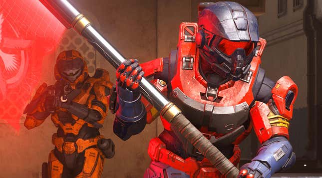 Two spartans in Halo Infinite, one red and one orange, with the red one holding the flag.