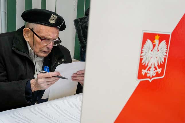 A man prepares his ballot for a parliamentary elections in Warsaw, Poland, Sunday, Oct. 15, 2023. Poland is holding an election Sunday that many see as its most important one since the 1989 vote that toppled communism. At stake are the health of the nation&#39;s democracy, its legal stance on LGBTQ+ rights and abortion, and the foreign alliances of a country on NATO&#39;s eastern flank that has been a crucial ally to Ukraine. (AP Photo/Czarek Sokolowski)