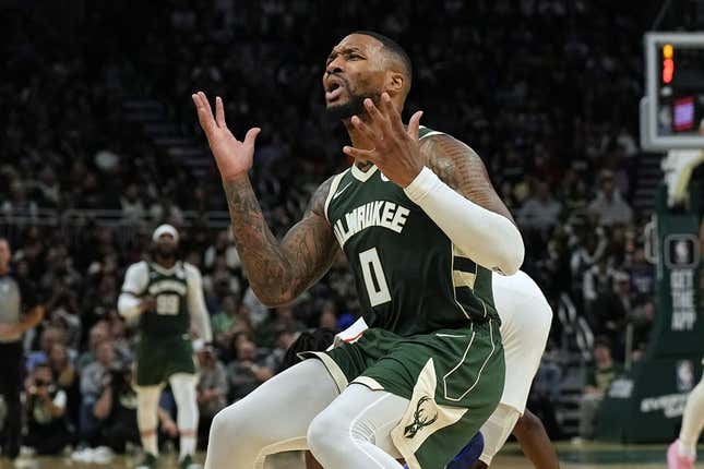 Oct 26, 2023; Milwaukee, Wisconsin, USA;  Milwaukee Bucks guard Damian Lillard (0) reacts after being called for a foul during the third quarter against the Philadelphia 76ers at Fiserv Forum.