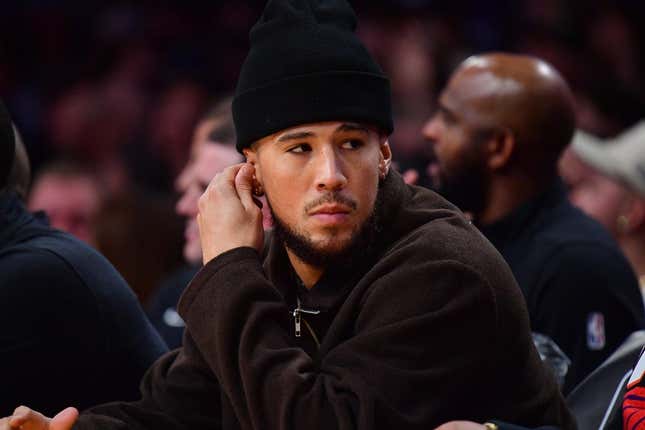 Oct 26, 2023; Los Angeles, California, USA; Phoenix Suns guard Devin Booker (1) watches game action against the Los Angeles Lakers during the first half at Crypto.com Arena.