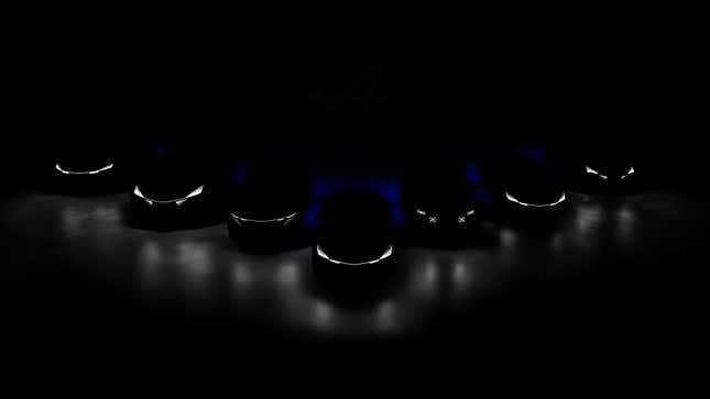 Alpine teaser image of seven future models illuminated only by their headlights, arranged in an arrow formation.