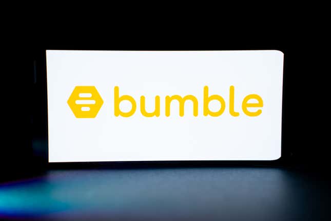 The Bumble dating app logo is being displayed on the screen of a mobile phone.