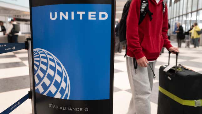 Passengers check in for United Airlines flight