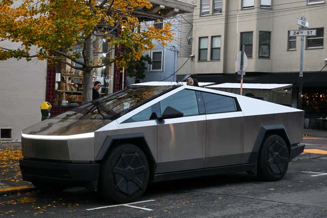 A Tesla Cybertruck parked on a city street