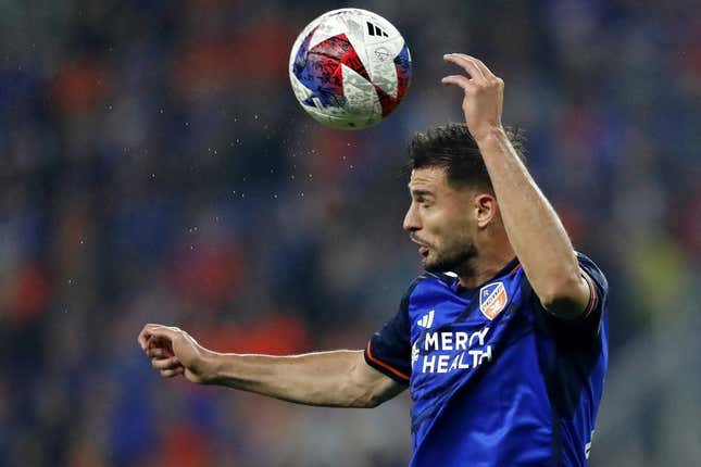 Oct 29, 2023; Cincinnati, OH, USA; FC Cincinnati defender Matt Miazga (21) heads the ball against the New York Red Bulls during the first half of game one in a round one match of the 2023 MLS Cup Playoffs at TQL Stadium.