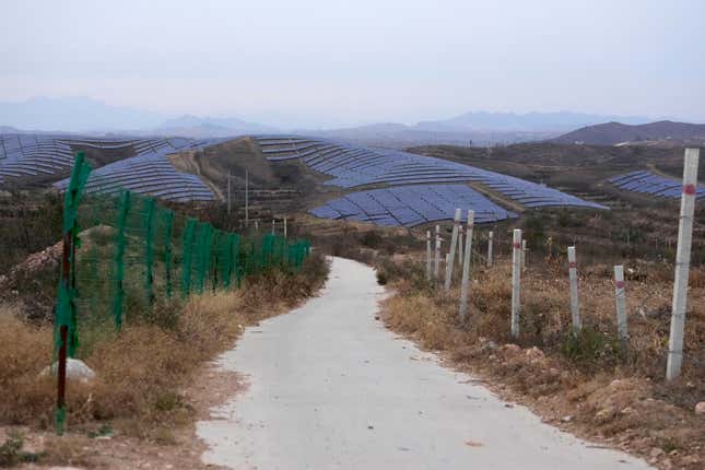 A solar farm is seen next to Donggou village near Shijiazhuang city in the northern China&#39;s Hebei province, Friday, Nov. 10, 2023. To meet the goal of limiting global warming to 1.5 degrees Celsius (2.7 degrees Fahrenheit), nine major Asian economies must increase the share of electricity they get from renewable energy from the current 6% to at least 50% by 2030, according to a report by a German thinktank released Wednesday, Nov. 15, 2023. (AP Photo/Ng Han Guan)