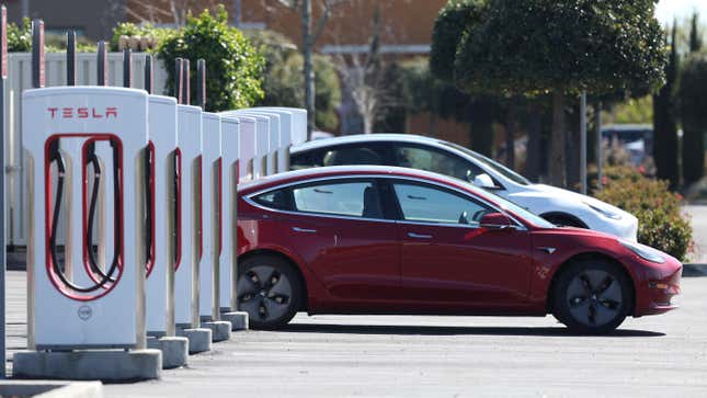 A Tesla car recharges its battery at the Petaluma Supercharger on March 09, 2022 in Petaluma, California. With oil prices continuing to soar, shares for companies in the electric vehicle sector are rising as consumers look to trade their gas powered cars in for electric vehicles. 