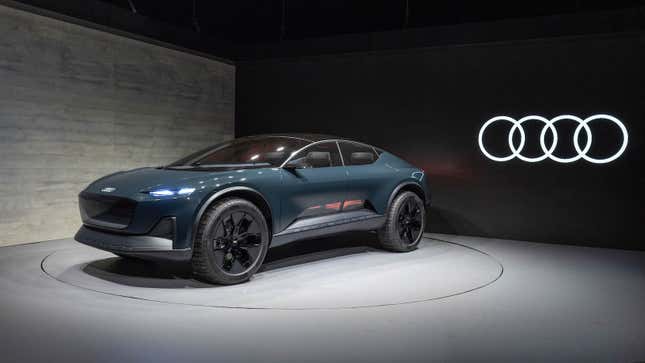 The dark blue-gray Audi Activesphere concept is parked on a turntable.