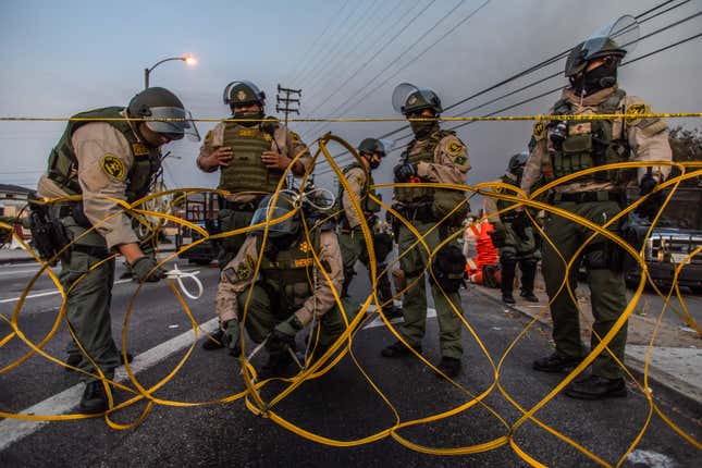 Los Angeles Sheriff’s deputies set up a barrier to block Imperial Hwy at the intersection of Normandie Avenue in South Los Angeles to protect the Sheriff’s Department station as protesters gather for the fifth consecutive night in the wake of Dijon Kizzee’s killing, in Los Angeles, California on September 9, 2020. The LA County Sheriff’s Department is one of many that resist releasing public records on misconduct.