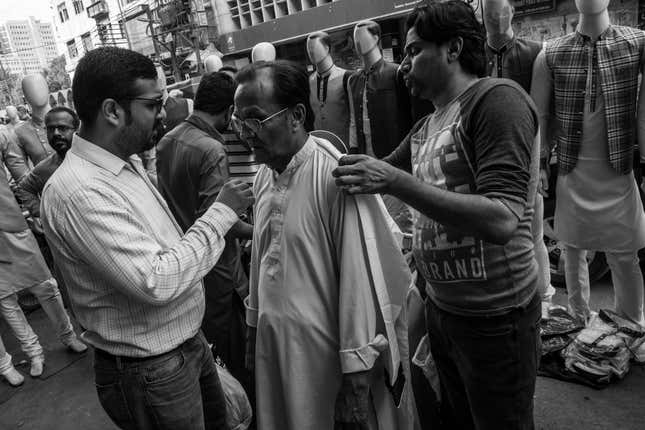 Many of Saddar’s cloth shops spill out onto the sidewalk or even onto the main road, worsening the traffic and congestion.