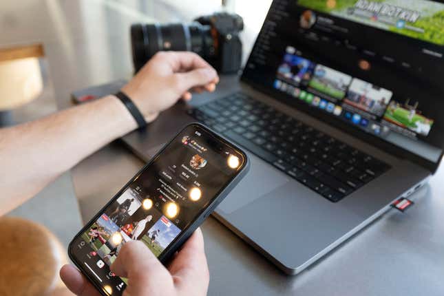 FILE - Adam Botkin, a football TikTok influencer, edits a video for a post at a Chipotle Mexican Grill while eating dinner, May 3, 2023, in Missoula, Mont. A federal judge ruled Thursday, Nov. 30, that Montana can’t enforce a first-in-the-nation law banning the video sharing app TikTok in the state while a legal challenge to the law moves through the courts. (AP Photo/Tommy Martino, File)