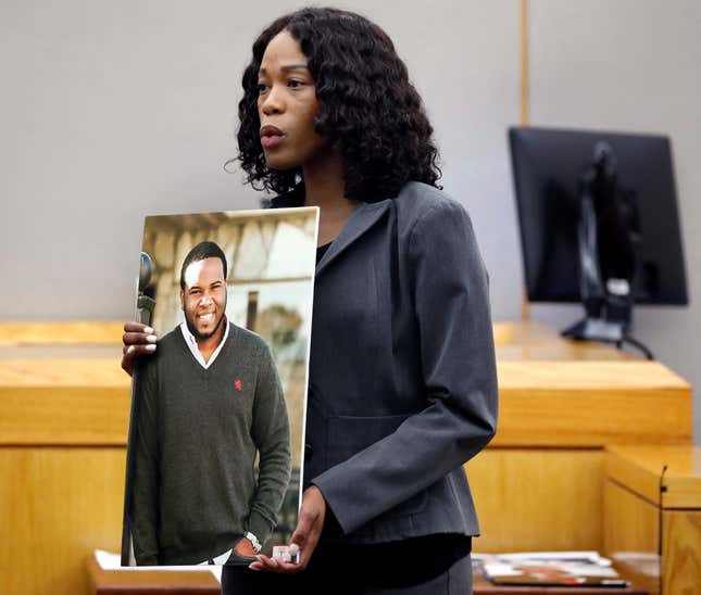 Assistant District Attorney Mischeka Nicholson shows the jury a photo of victim Botham Jean during closing remarks in the sentencing phase of former Dallas Police Officer Amber Guyger’s murder trial, Wednesday, Oct. 2, 2019, in Dallas. 