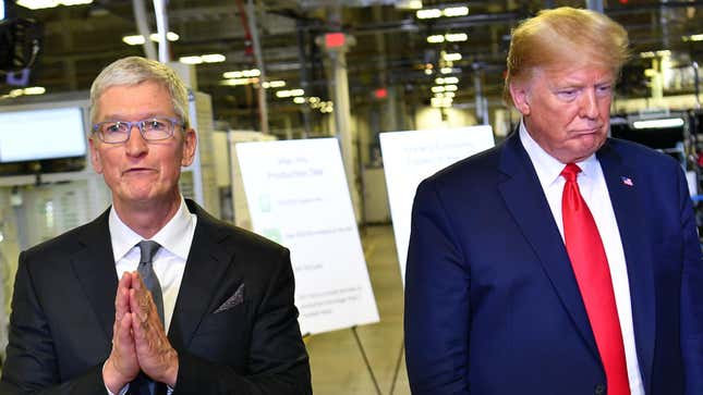 US President Donald Trump (R) and Apple CEO Tim Cook speak to the press during a tour of the Flextronics computer manufacturing facility where Apple’s Mac Pros are assembled in Austin, Texas, on November 20, 2019. 
