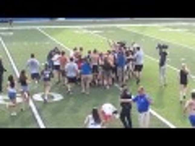 Cop Trips High School Kids Rushing Field To Celebrate State Title Win
