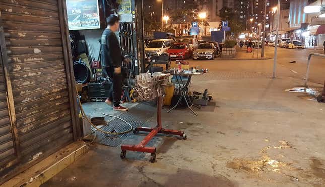 Image for article titled The Most Dedicated Mechanics In The World Wrench On The Streets Of Hong Kong
