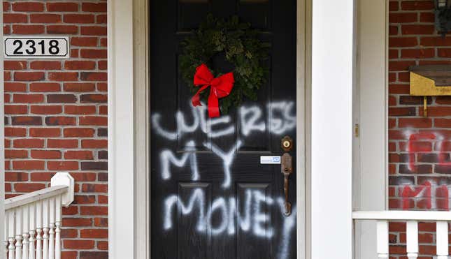 Graffiti reading, “Where’s my money” is seen on a door of the home of Senate Majority Leader Mitch McConnell, R-Ky., in Louisville, Ky., on Saturday, Jan. 2, 2021.
