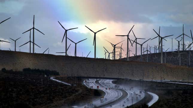 A rainbow forms behind giant windmills in California.