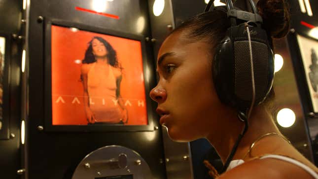 A fan of the former rhythm-and-blues singer and actress Aaliyah listens to the new Aaliyah album Aug. 27, 2001, in New York City.