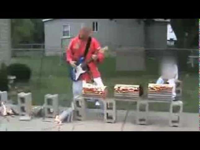 A Man Playing the Guitar While Doing Karate