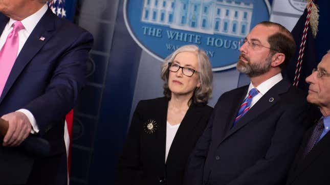 CDC Agency for Toxic Substances and Disease Registry Principal Deputy Director Anne Schuchat and US Secretary of Health Alex Azar listen to President Donald Trump as he speaks during a news conference on the COVID-19 outbreak at the White House on February 26, 2020. 