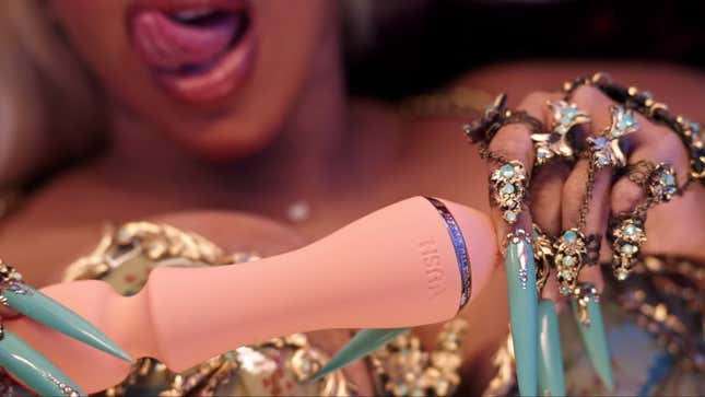 Image for article titled Cardi B Using a White Man As a Table, and Other Important Moments from the 'Up' Video