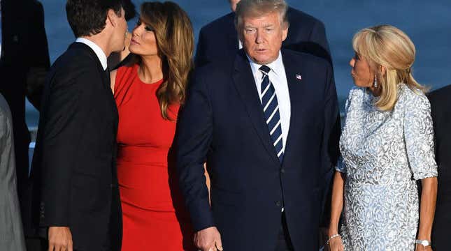 Canada’s Prime Minister Justin Trudeau, US First Lady Melania Trump, President Donald Trump, French President’s wife Brigitte Macron join G7 leaders and guests as they gather for a family picture on the second day of the annual G7 summit on August 25, 2019 in Biarritz, France.